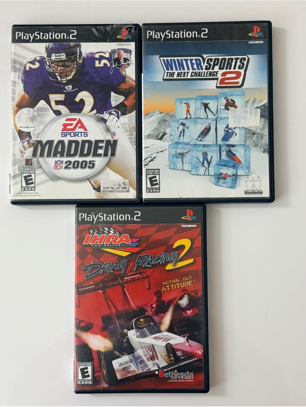 Sony PlayStation 2 Game Trio – Black, White, Red, Blue